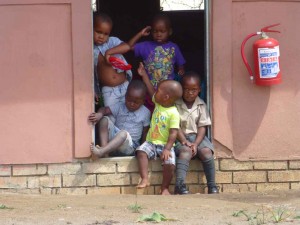 Kids in front of rooms 2
